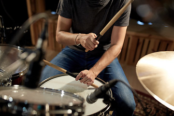 Image showing male musician playing drums and cymbals at concert