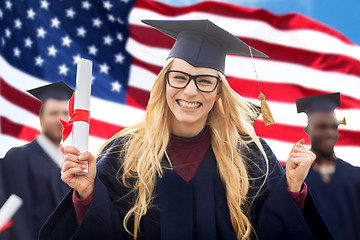 Image showing happy student with diploma celebrating graduation