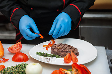 Image showing Chef set grilled meat