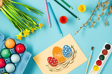 Image showing The top view of easter on blue table office workplace