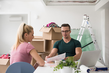 Image showing Young couple moving in a new home