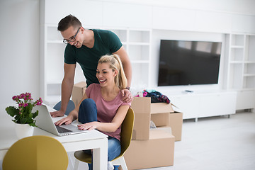 Image showing Young couple moving in a new home