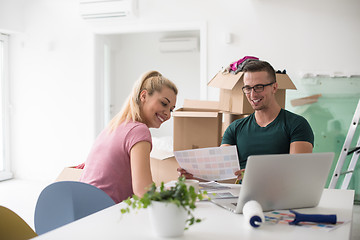 Image showing Young couple moving in a new home