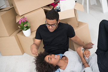 Image showing African American couple relaxing in new house