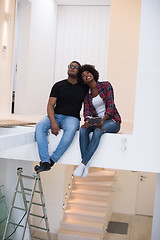 Image showing couple having break during moving to new house