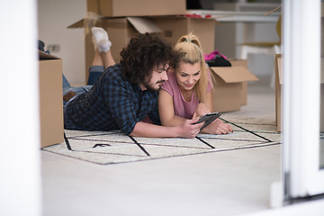 Image showing Young couple moving in a new flat