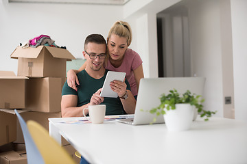 Image showing Young couple moving in a new home