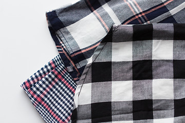 Image showing close up of checkered shirt on white background