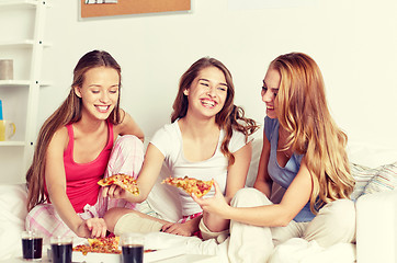 Image showing happy friends or teen girls eating pizza at home