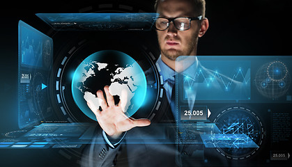 Image showing businessman with virtual earth globe projection