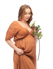 Image showing happy pregnant woman with white rose flower