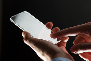 Image showing close up of businessman with glass smartphone