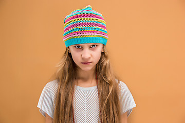 Image showing Angry young girl in hat looking at camera with hate