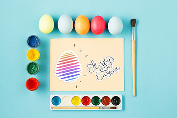 Image showing The top view of easter on blue table office workplace