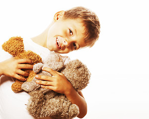 Image showing little cute boy with many teddy bears hugging isolated close up