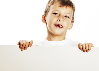 Image showing little cute boy holding empty shit to copyspace isolated close u