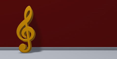 Image showing golden clef on red wall 3d rendering 
