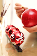 Image showing Decorating baubles, handmade