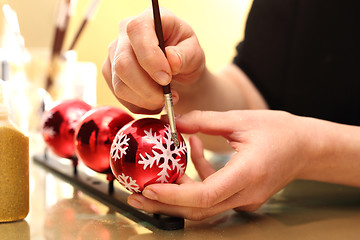 Image showing Decorating baubles, handmade Painting of Christmas decorations