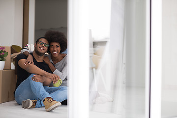 Image showing African American couple relaxing in new house