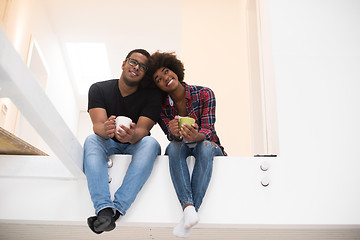 Image showing couple having break during moving to new house