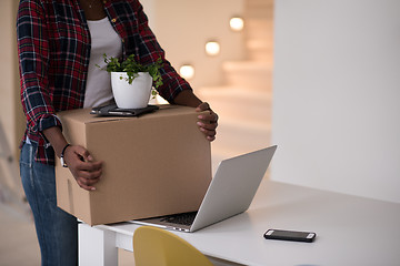 Image showing Black girl moving in the new apartment