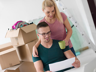 Image showing Young couple moving in a new home