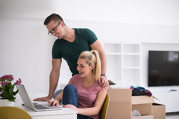 Image showing Young couple moving in a new home