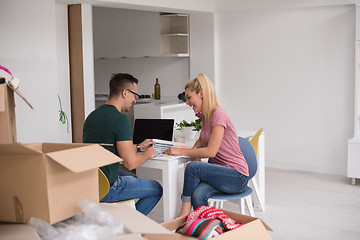 Image showing Young couple moving in a new home