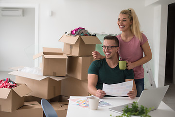 Image showing Young couple moving in a new home