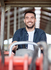 Image showing man or farmer driving tractor at farm