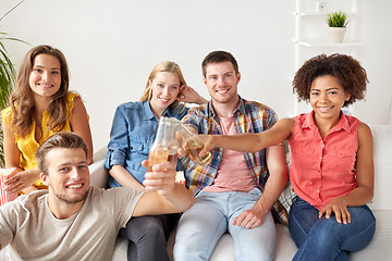 Image showing happy friends with popcorn and beer at home