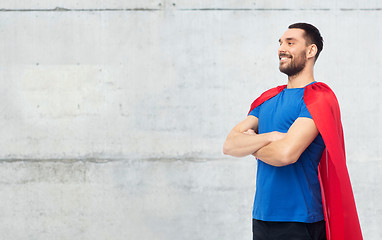 Image showing happy man in red superhero cape