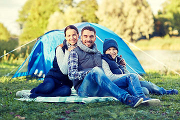 Image showing happy family with tent at camp site