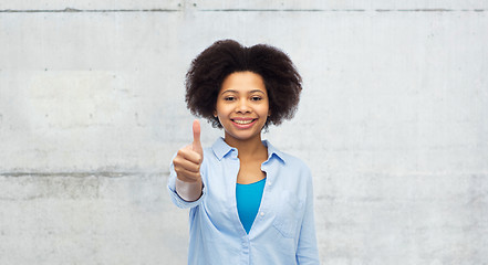 Image showing happy afro american woman showing thumbs up