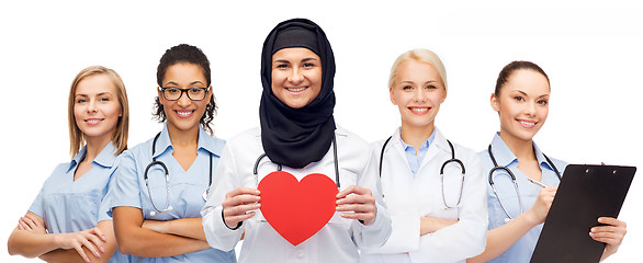 Image showing group of doctors with red heart and clipboard