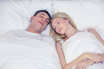 Image showing happy couple sleeping in bed