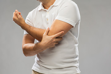 Image showing close up of man suffering from pain in hand