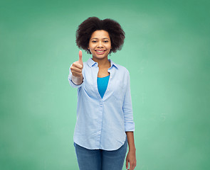 Image showing happy afro american woman showing thumbs up