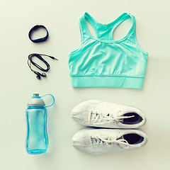 Image showing sportswear, bracelet, earphones and bottle set