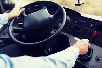 Image showing close up of driver driving passenger bus