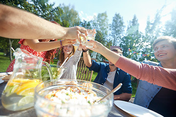 Image showing happy friends with drinks at summer garden party