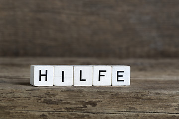 Image showing German word help, written in cubes