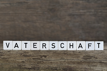 Image showing German word fatherhood, written in cubes    