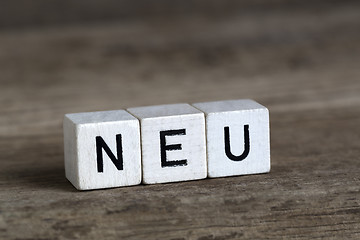 Image showing German word new, written in cubes