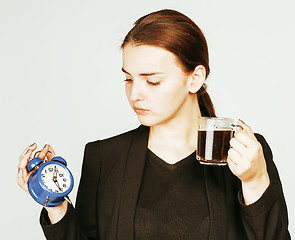 Image showing young beauty woman in business style costume waking up for work 