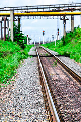 Image showing Railroad tracks go off into the distance, blur