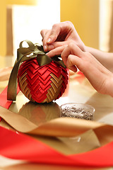 Image showing Holy Christmas, a woman carries a beautiful home decorations