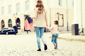 Image showing close up of mother and child shopping in city