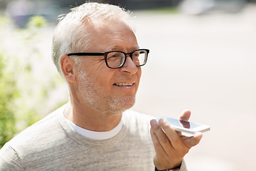 Image showing old man using voice command recorder on smartphone